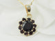 Collier Collier pendentif marguerite en or jaune et grenats 58 Facettes 33127