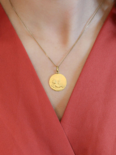 Pendentif Pendentif religieux vintage Jésus nouveau né or jaune 58 Facettes 1087.17