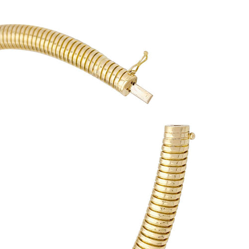 Collier Collier tubogas vintage, or jaune, émeraude, diamants. 58 Facettes 33792