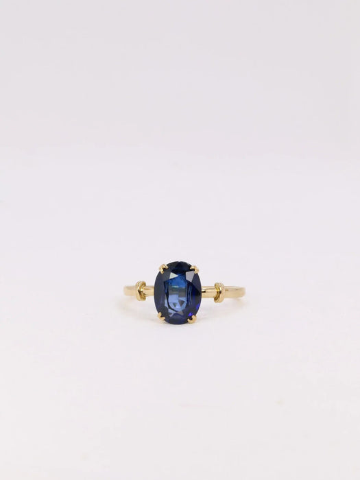 Yellow gold oval sapphire ring