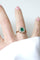 Bague 54 Bague Marguerite or rose, émeraude colombienne et diamants 58 Facettes