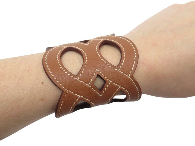 Bracelet bracelet HERMES manchette entrelacs cuir swift h081205cc37t2 16-17cm 58 Facettes 266719