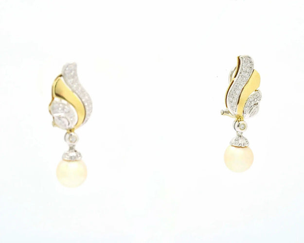 Boucles d'oreilles Boucles d'oreilles en or jaune et blanc avec perles 58 Facettes 10693