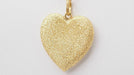 Pendentif Pendentif Coeur sablé de Carolina BUCCI en or jaune 58 Facettes 32863