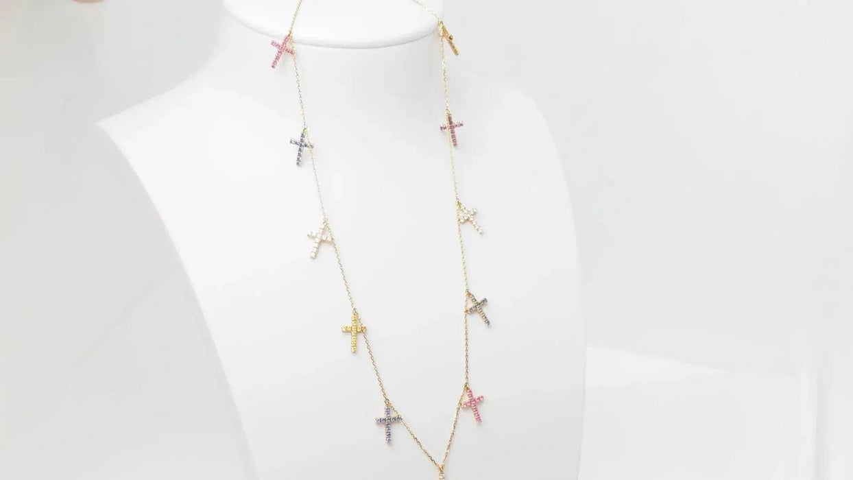 Collier CARTIER - Collier 11 Croix en or rose diamants et saphirs de couleurs 58 Facettes 32788