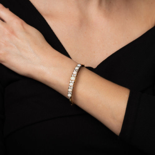 Bracelet Bracelet jonc ancien victorien en or jaune 14 carats, orné d'opale et de diamants. Bijou de haute qualité. 58 Facettes G14218