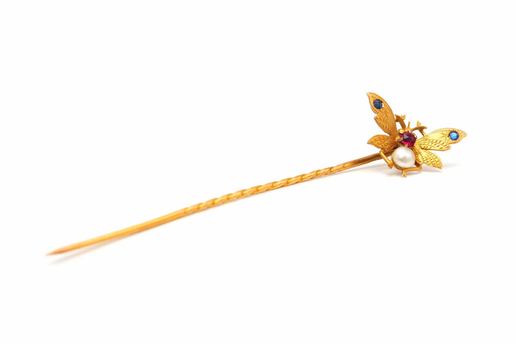 Broche Broche Art Nouveau en or jaune sertie d'une perle, de saphirs et de rubis 58 Facettes 22483