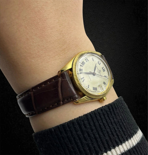Montre Baume et Mercier - Boîtier Baumatic en or jaune 58 Facettes