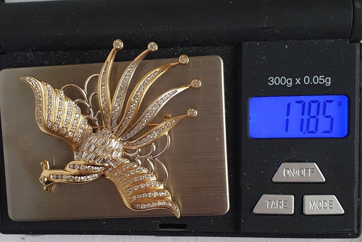 Broche Broche OISEAU DE PARADIS or jaune diamants 58 Facettes R 1137  MKEE