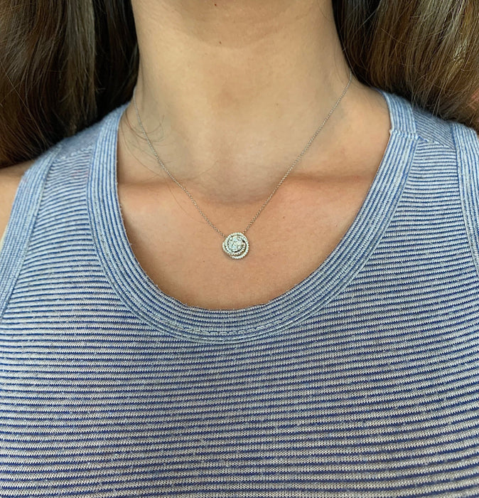 White gold diamond swirl necklace