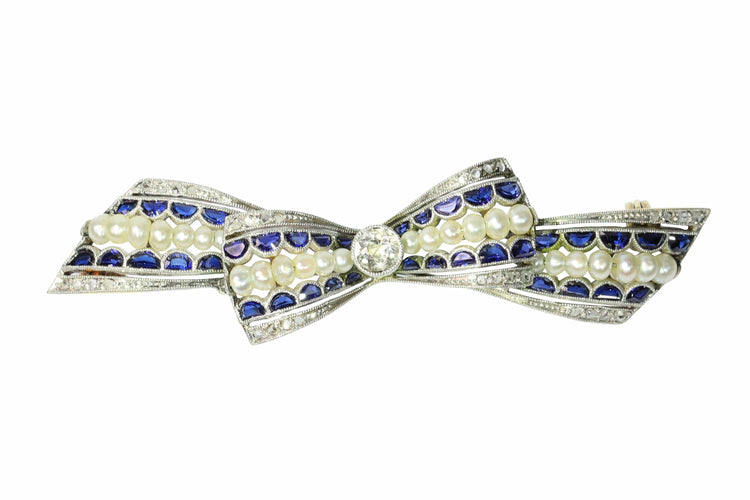 Broche Broche nœud vintage des années 1910 en saphirs et perles – Belle Époque Grace 58 Facettes 25191-0322