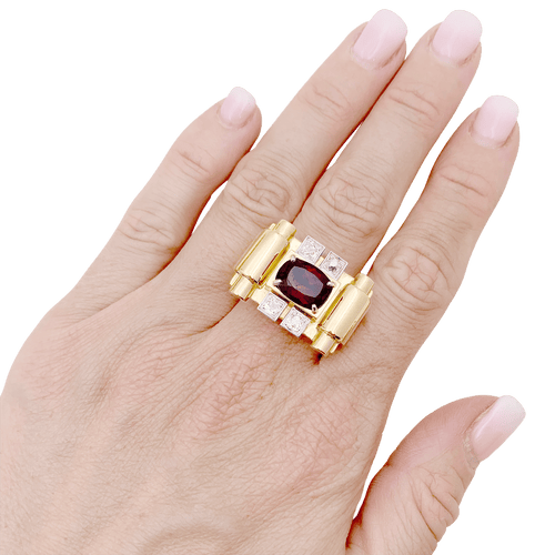 Bague 54 Bague "tank", deux tons d'or, grenat et diamants. 58 Facettes 34577