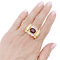 Bague 54 Bague "tank", deux tons d'or, grenat et diamants. 58 Facettes 34577