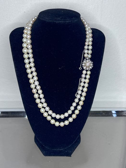 Superb double row necklace 124 cultured pearls gold and diamond clasp