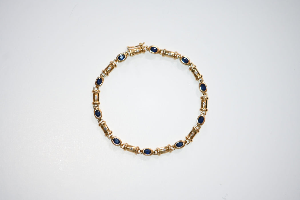 Gold Bracelet Adorned With Diamonds And Sapphires