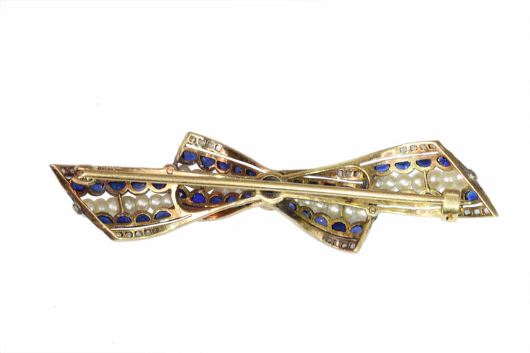 Broche Broche nœud vintage des années 1910 en saphirs et perles – Belle Époque Grace 58 Facettes 25191-0322