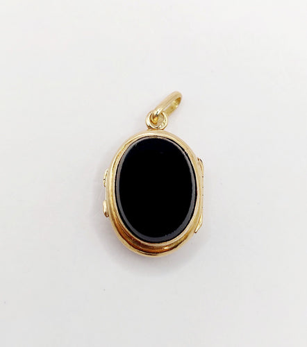 Pendentif Pendentif porte-photo or jaune et onyx (circa 1900) 58 Facettes A05916
