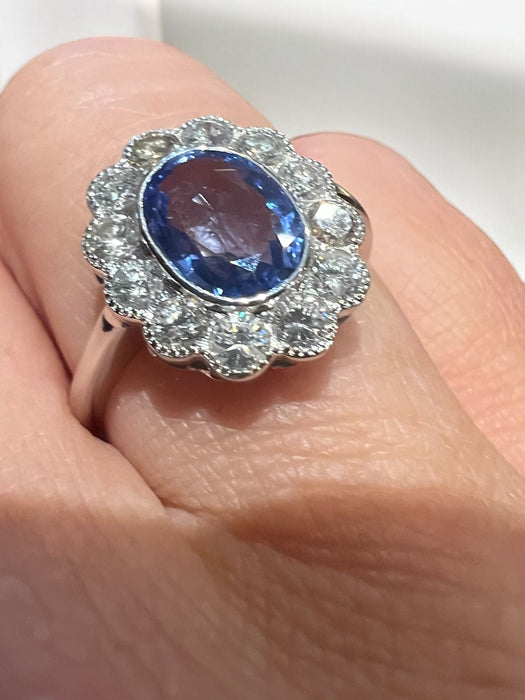 white gold ring with sapphire and brilliant surround