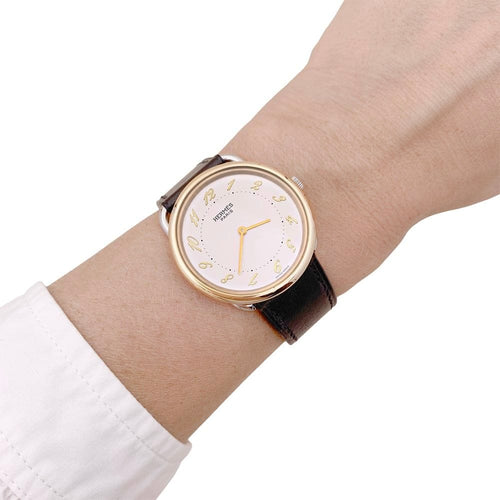 Montre Montre HERMÈS, "Arceau", plaqué or et acier. 58 Facettes 34828