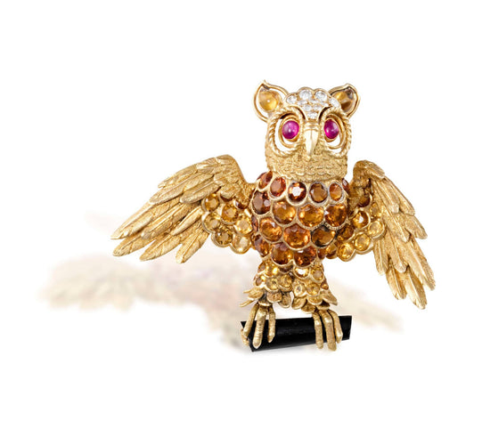 Broche CHAMPAGNAT broche en or jaune stylisant un hibou, travail français vers 1960 58 Facettes 042303.03