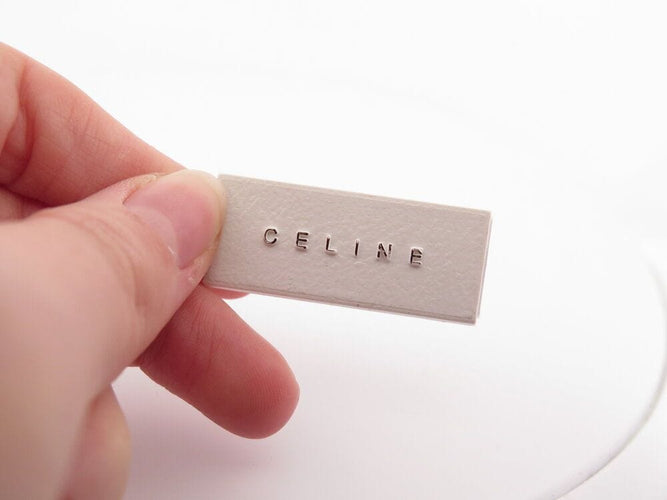 Montre montre CELINE macadam triomphe 35 mm quartz classique acier palladie 58 Facettes 267061