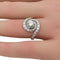 Bague 54 Bague tourbillon or, platine & diamants 58 Facettes