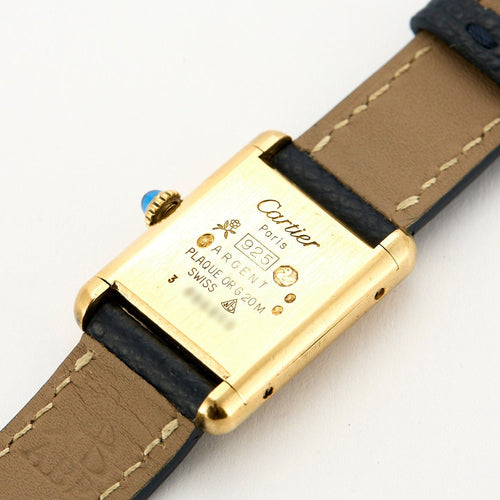 Montre CARTIER - Montre Modèle Tank Must en argent plaqué or, cadran laqué noir 58 Facettes