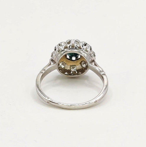 Bague 54 Bague Marguerite en or blanc ornée d'un saphir et de diamants 58 Facettes