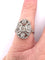 Bague 52 Bague en platine avec diamant central et diamants environnants 58 Facettes