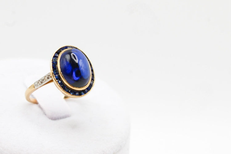 Bague Bague or jaune, platine, saphir cabochon 58 Facettes 250101