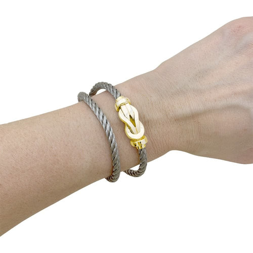 Bracelet Bracelet Fred, "Chance infinie", or rose et acier. 58 Facettes 35323