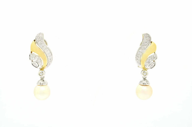 Boucles d'oreilles Boucles d'oreilles en or jaune et blanc avec perles 58 Facettes 10693