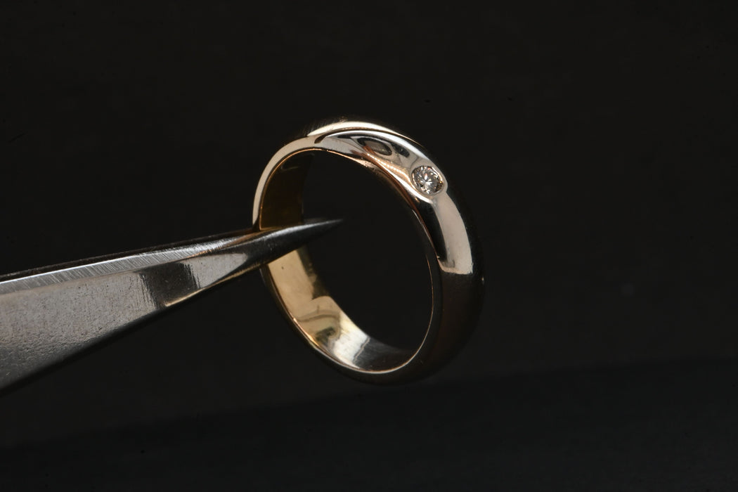 yellow and white gold men's wedding ring set with a diamond