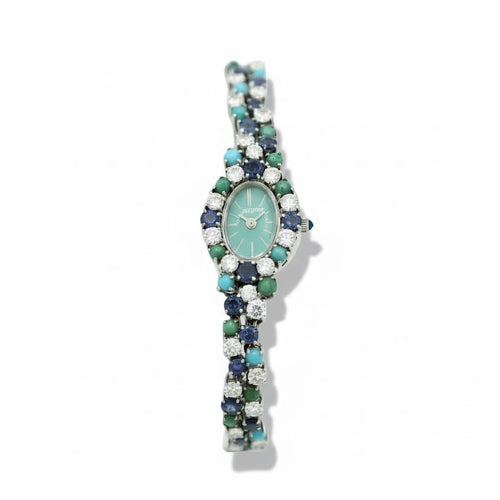 Montre Uti - Montre Ovale - Or Blanc - Diamants, Saphirs et Turquoise 58 Facettes 1.0001001/1