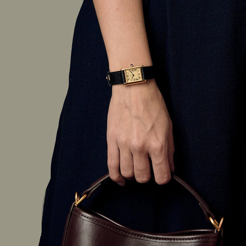 Montre CARTIER - Montre Tank Must en argent plaqué or, cadran blanc chiffres romains 58 Facettes