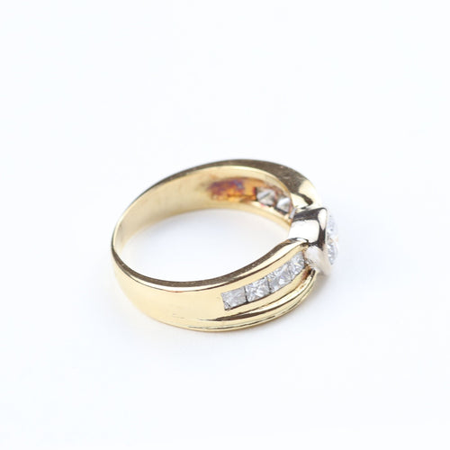 Anillo en oro amarillo 18K con diamantes talla brillante y princesa 58 Facettes 129555D