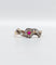 Bague 55 Bague marguerite antique or rose, rubis et diamants (c.1890) 58 Facettes A05453