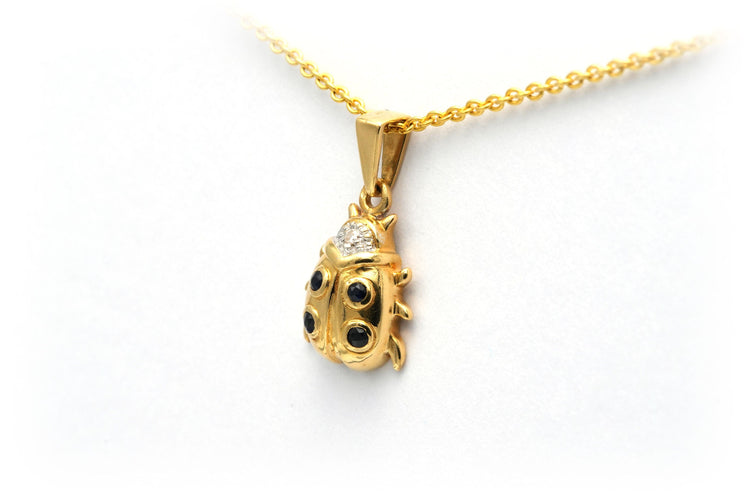 Pendentif Pendentif "coccinelle" contemporain en or jaune serti de saphirs et de diamants 58 Facettes 20754