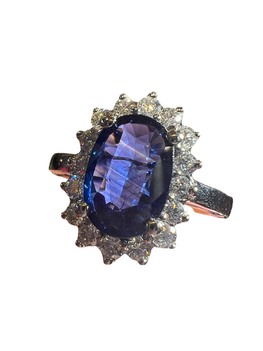 white gold sapphire ring surrounded by diamonds