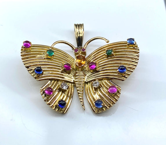 Pendente a farfalla in oro giallo e pietre preziose 