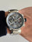 Montre Louis Vuitton - Montre chronographe Tambour Voyage en acier 58 Facettes
