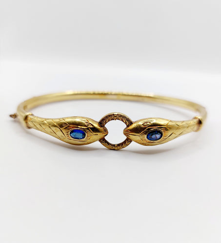 Bracelet Bracelet serpent à deux têtes or jaune et pierre bleues (circa 1920) 58 Facettes A06347