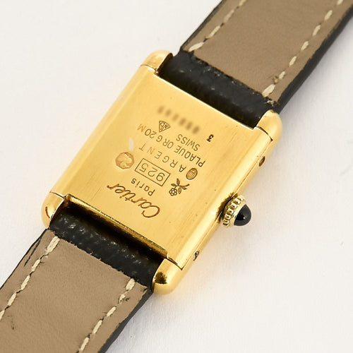 Montre CARTIER - Montre Tank Must en argent plaqué or, cadran blanc chiffres romains 58 Facettes