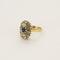 Bague 52,5 Bague marguerite en or jaune, blanc, saphirs et diamants 58 Facettes BIA10252