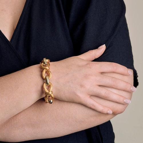 Flexible bracelet in brushed yellow gold and white gold 