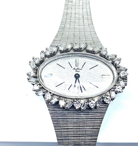 Montre Montre de dame en or blanc 18 carats en diamants ronds et baguettes. Signée PAILLARD PARIS 58 Facettes AB208