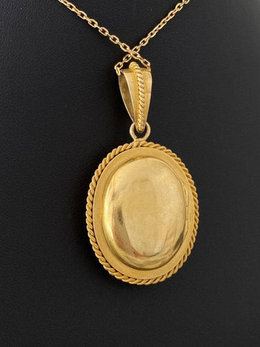 Pendentif Pendentif porte-photo en or jaune serti d'un camée en Agate 58 Facettes