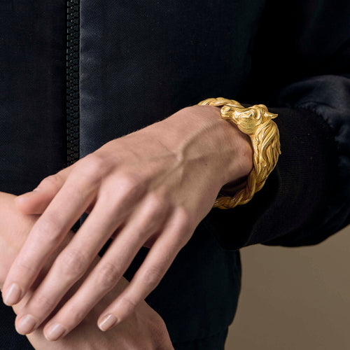 HERMES - Pulseira rígida em ouro amarelo com motivo de cavalo 