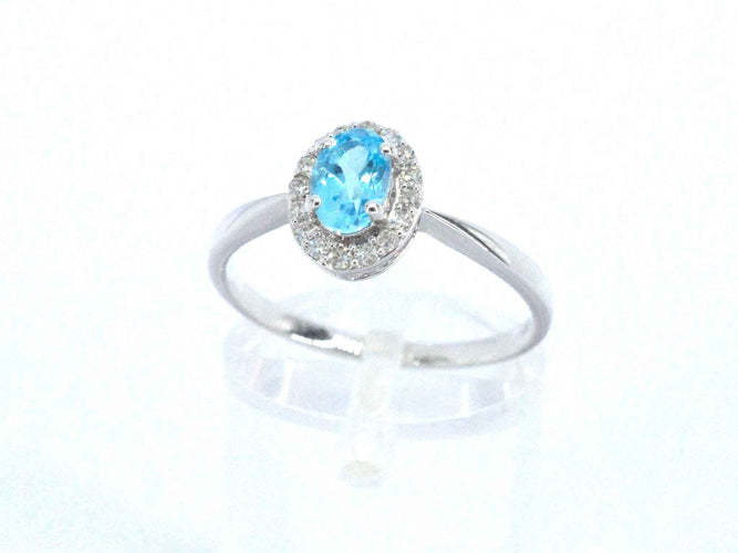 Bague Bague en or blanc avec une topaze bleue et des diamants naturels 58 Facettes 2367