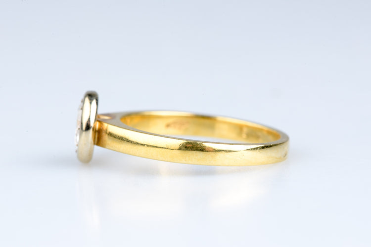 Bague 54 Bague solitaire en or jaune, serti clos d’un diamant rond brillant o,70 ct 58 Facettes 312231